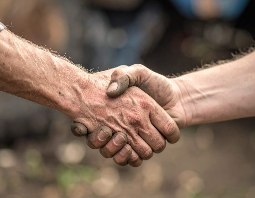 Two men shaking hands, zoom on the handshake