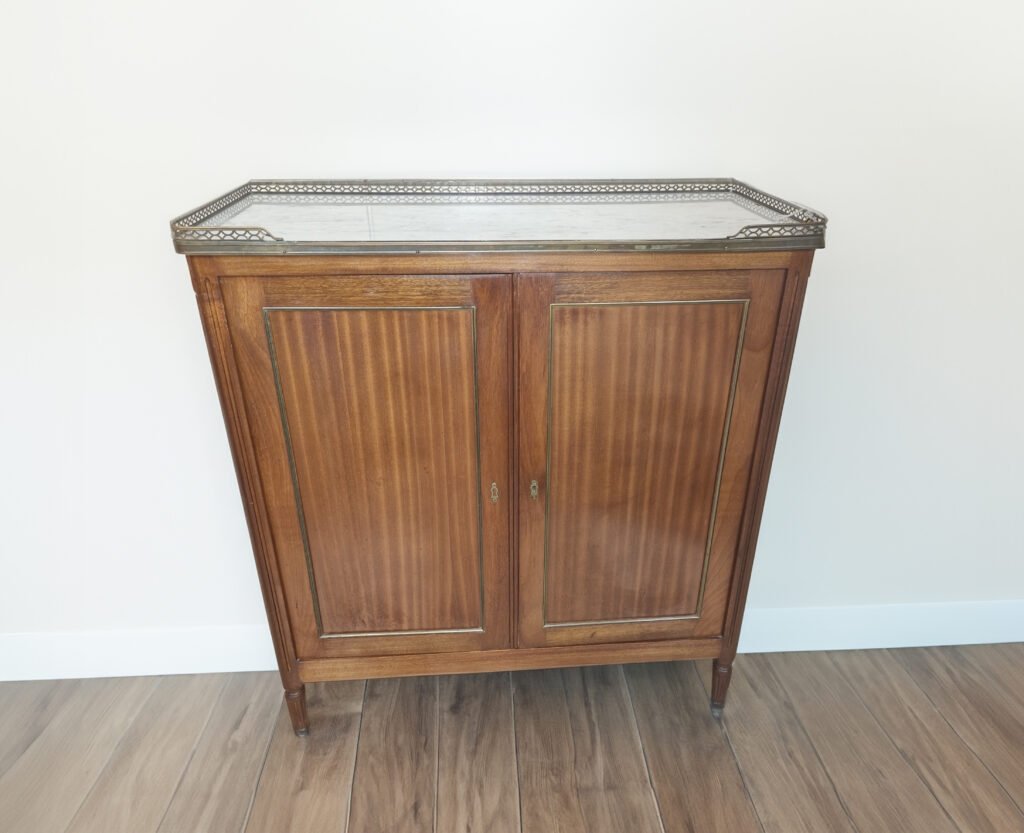 A wooden, louis sixteen, french antique buffet, with a white marble top and gallery